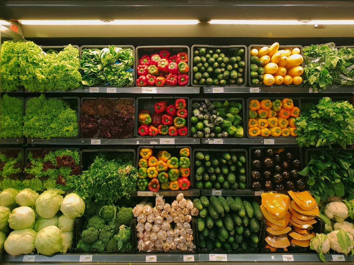 Colourful fresh produce and grocery shelves stocked with seasonal fruit and vegetables